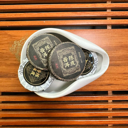 ЧЕНЬ ПІ ШУ ПУЕР - ШУ ПУЕР З МАНДАРИНОВОЮ ШКІРКОЮ (陈皮熟普洱 / Chén Pí Shú Pǔ'ěr)