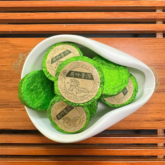 ХЕ Є ШУ ПУЕР - ШУ ПУЕР З ЛОТОСОМ (荷叶普洱 / Hé Yè Pǔ'ěr)